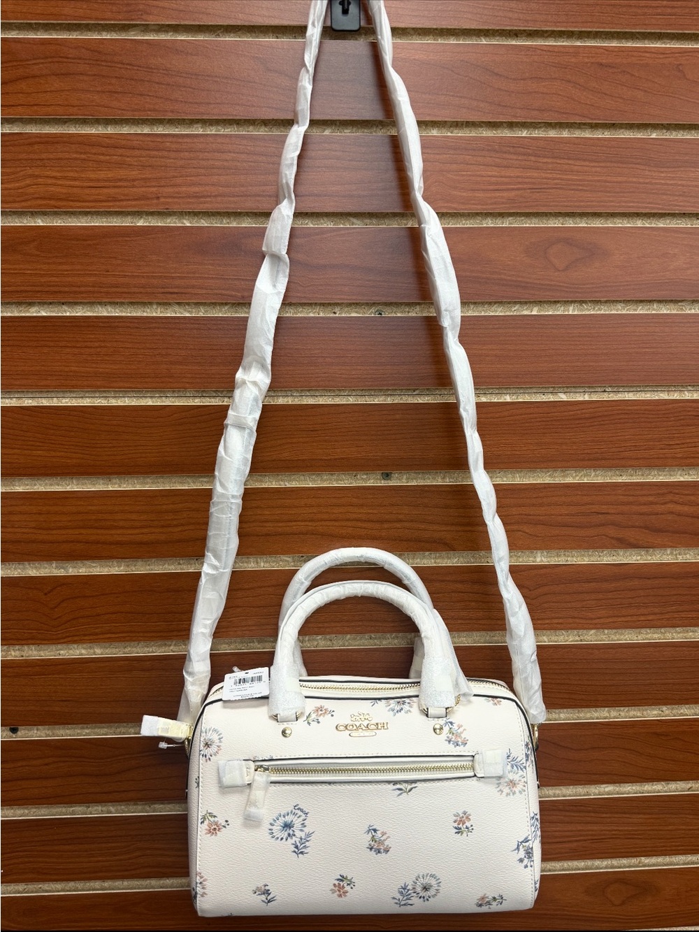Coach Rowan Satchel in the white Dandelion Floral